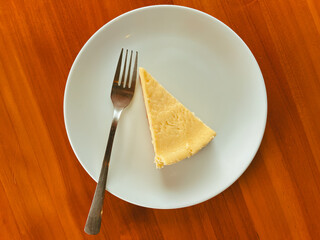 Appetizing Slice Of Vanilla Cheesecake Dessert On A Ceramic Plate