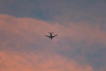 Silhouette of an Airplane Ascending into a Beautiful Sunset Sky Scenery