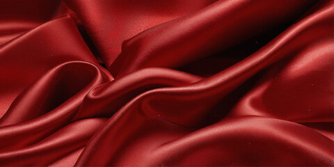 Obraz premium Close-up of a rich, deep red satin fabric. A close-up shot showcasing the luxurious drape and texture of a deep red satin fabric. 