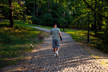 Man walking on park path