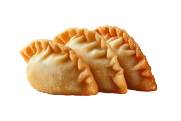 Three golden crispy fried empanadas with crimped edges, cut out