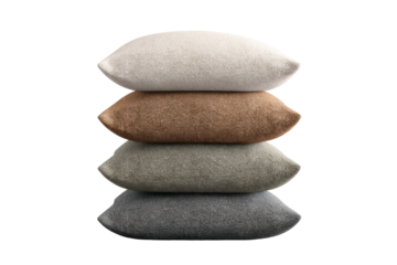 Stack of four cozy textured throw pillows in neutral tones, cut out