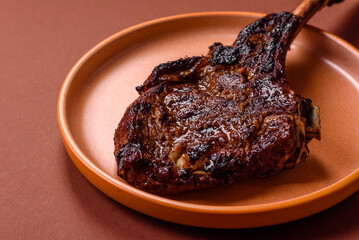 Grilled bone-in meat, beef tomahawk steak, juicy barbecued meat. Tomahawk steak