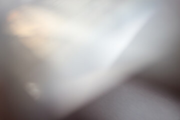 Soft focus gray, black grain blur texture wall with prism refraction. Light and shadow smoke abstract gradient rays background.