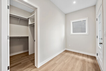 Small, empty room with a window and a door