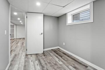 White door is open in a room with a window