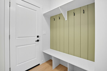 White door with a black handle and a white doorknob