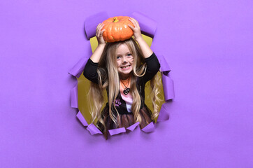 Girl with Halloween pumpkin, studio