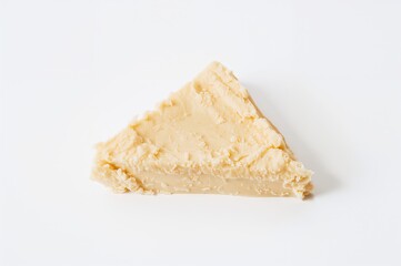 Triangular cream cheese piece on a white background