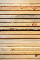 Obraz premium Natural surface of stacked wood timbers. Vertical view