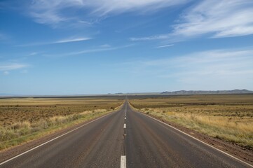 Scenic view of a deserted rural highway cutting through farmland