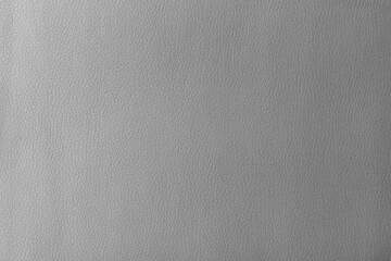 Texture of genuine leather, artificial leatherette grey background