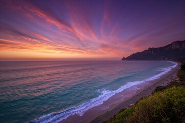 Fototapeta premium Stunning hues and illumination during a romantic seaside sunset on a beautiful beach