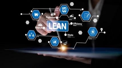 A business professional uses a digital tablet to present key concepts of lean management. The image...