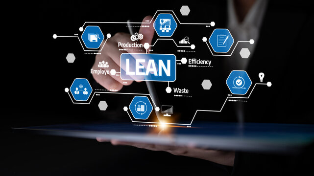 A business professional uses a digital tablet to present key concepts of lean management. The image features graphics that emphasize production and efficiency strategies. Tessel