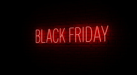 Obraz premium A bold neon sign illuminates the phrase Black Friday against a dark backdrop.