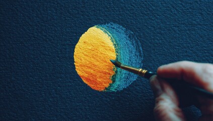 Hand painting a stylized sun on dark canvas