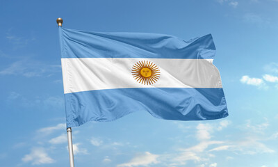 Argentinian national flag waving in the sky with sun of may symbolizing freedom and independence of Argentina