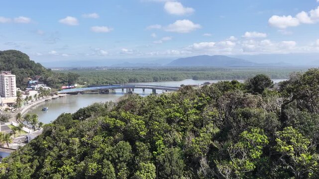 Itanhaem River In Itanhaem Sao Paulo Brazil. Tropical River With A Scenic Forest Trees Viewed From Above. Countryside Dramatic Clouds Rural Field. Agro Rural Panoramic View. Itanhaem Sao Paulo.