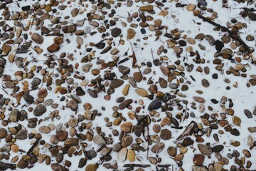 Pebbles on Snowy Ground 