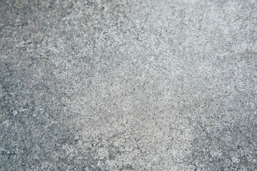 Textured surface with gray tones and subtle patterns in natural light