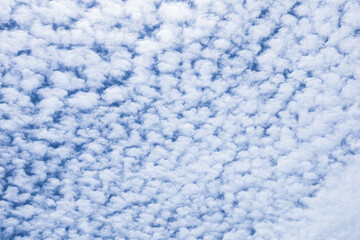 Beautiful cloud patterns in a bright blue sky during midday hours