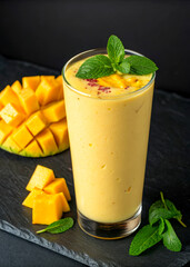 Refreshing Mango Smoothie in Glass with Fresh Mango Chunks and Mint