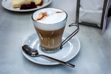 Cappuccino served in a coffee shop on a marble table