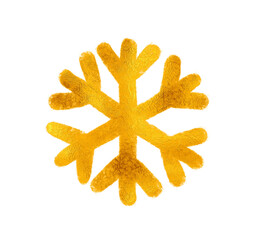 A snowflake painted by hand with gold metallic paint. A decorative snowflake made of gold foil.