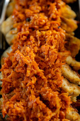 Enjoy delectable dumplings topped with a flavorful carrot relish, an unforgettable treat