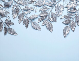 Silver leaves on a light blue background