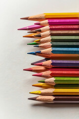 Fototapeta premium colored pencils on a white drawing education