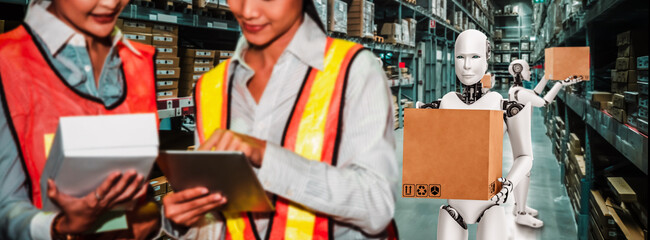 Naklejka premium Innovative industry robot working in warehouse together with human worker . Concept of artificial intelligence for industrial revolution and automation manufacturing process .