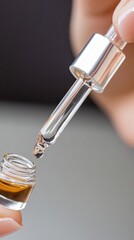 A woman applies a shimmering exfoliating serum with a dropper, highlighting skin texture, while an abstract scientific background conveys innovation and precision.