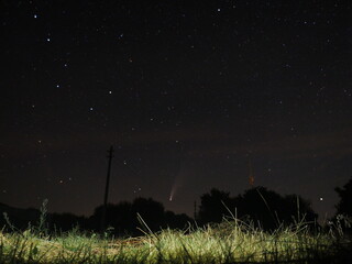 starry night sky A comet in the night sky over the village