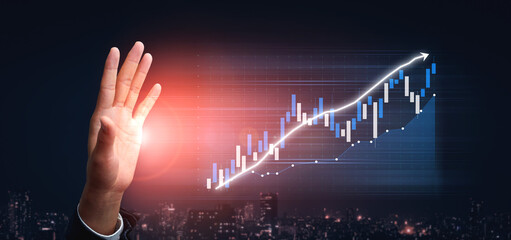 This image depicts a hand gesture symbolizing success in the financial market against a dynamic stock chart. The ascending graph represents growth and potential. Impute
