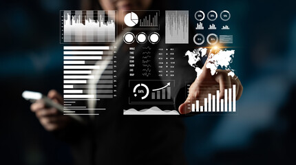 A business professional engages with digital data visuals, showcasing innovative analytics in a modern office. This scene highlights technology role in corporate decision-making. Impute