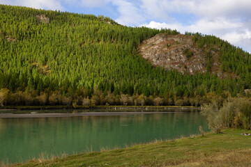 Tourism. Turquoise Katun River in Altai, wild nature of Siberia. Mountainous terrain