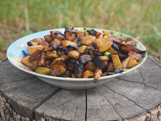 mushrooms Vegetables cooked in a cauldron over an open fire