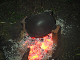bomb on a fire The first firing of the cauldron over an open fire 