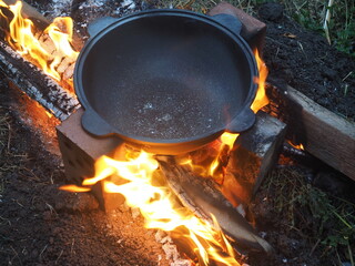 cooking on the campfire The first firing of the cauldron on an open fire