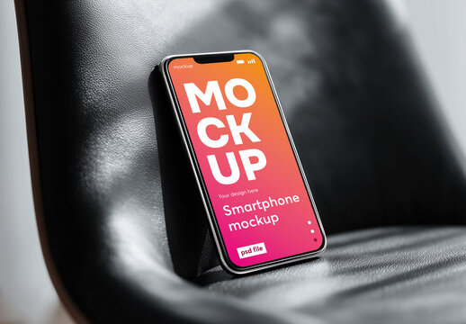 Smartphone on black chair mockup