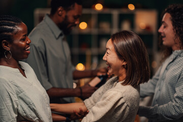 Friends enjoying a lively get together, sharing laughter and conversation