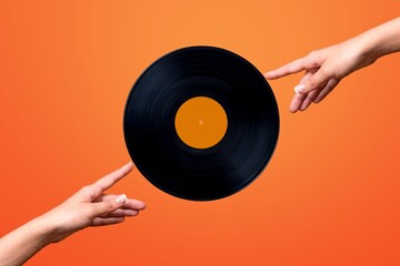 Human hand holding retro vinyl record