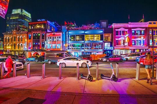 Evening view of colorfully illuminated Broadway Street, an American landmark known for it's country music establishments and vibrant nightlife, in Nashville, Tennessee, July 27 2025.