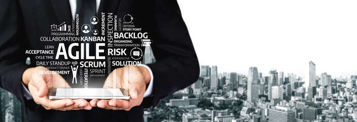 A businessman holds a tablet displaying key terms related to agile methodology on a city skyline background, highlighting teamwork and innovative project management strategies. Tessel