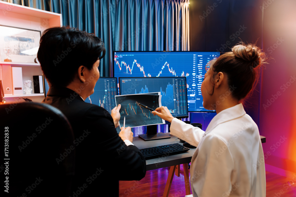 Poster asian businessman showing dynamic stock exchange graph paper with partner to discuss profit value on
