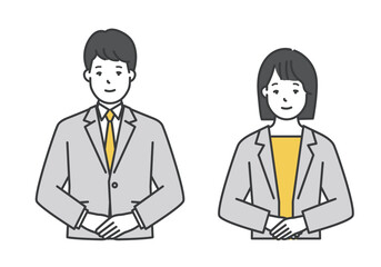 笑顔でポーズをとる男女ビジネスパーソン