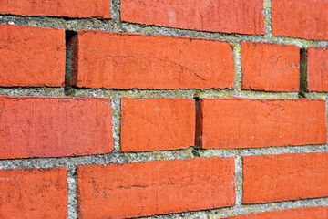 Fototapeta premium Brick wall with vertical voids missing mortar in joints