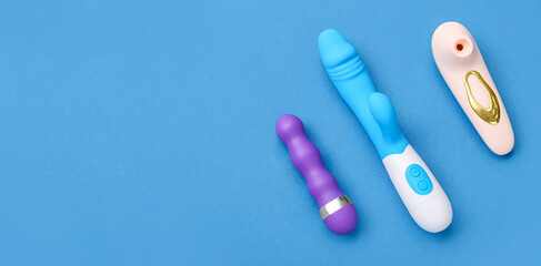 Different vibrators on blue background